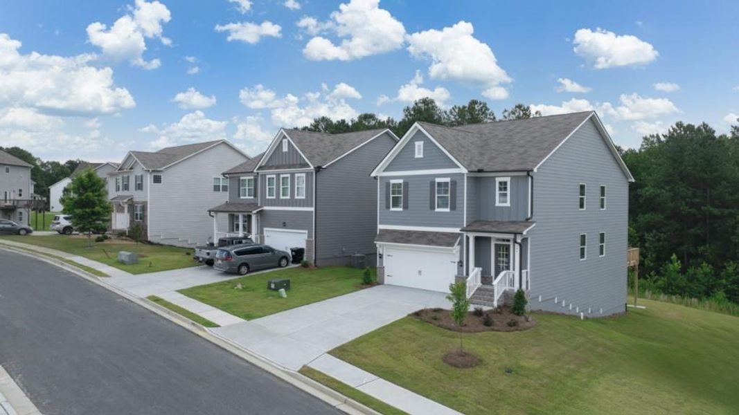 Front exterior of a new home in Lost Creek, Dallas, GA, highlighting curb appeal (Image 2). Front exterior of a new home in Lost Creek, Dallas, GA, highlighting curb appeal (Image 2).