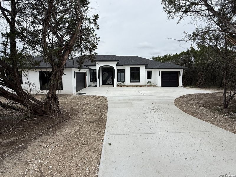 Front exterior of a new home in , Spring Branch, TX, highlighting curb appeal (Image 28).