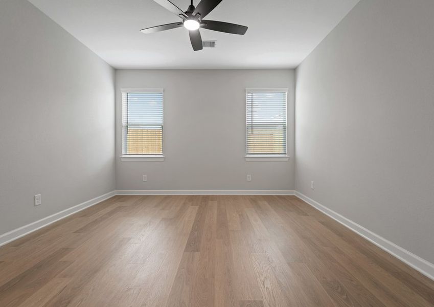 Master bedroom with two windows facing the backyard Master bedroom with two windows facing the backyard