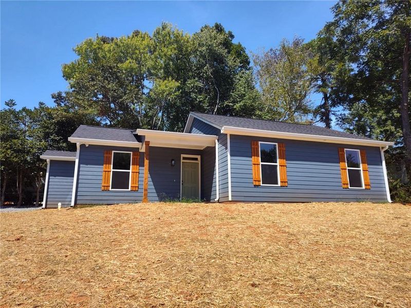 Front exterior of a new home in , Cumming, GA, highlighting curb appeal (Image 1). Front exterior of a new home in , Cumming, GA, highlighting curb appeal (Image 1).