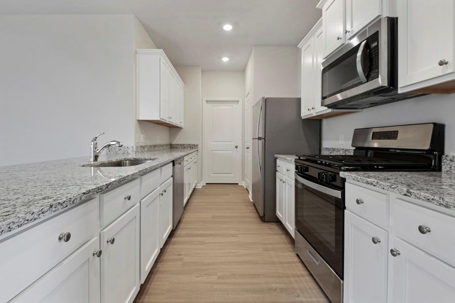 The kitchen comes with beautiful, granite countertops and Whirlpool appliances. The kitchen comes with beautiful, granite countertops and Whirlpool appliances.