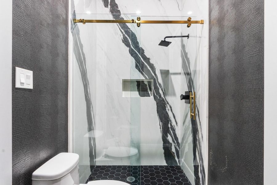 This bathroom offers a full walk in shower on the 1st floor. The stone selection is spectacular. This bathroom offers a full walk in shower on the 1st floor. The stone selection is spectacular.