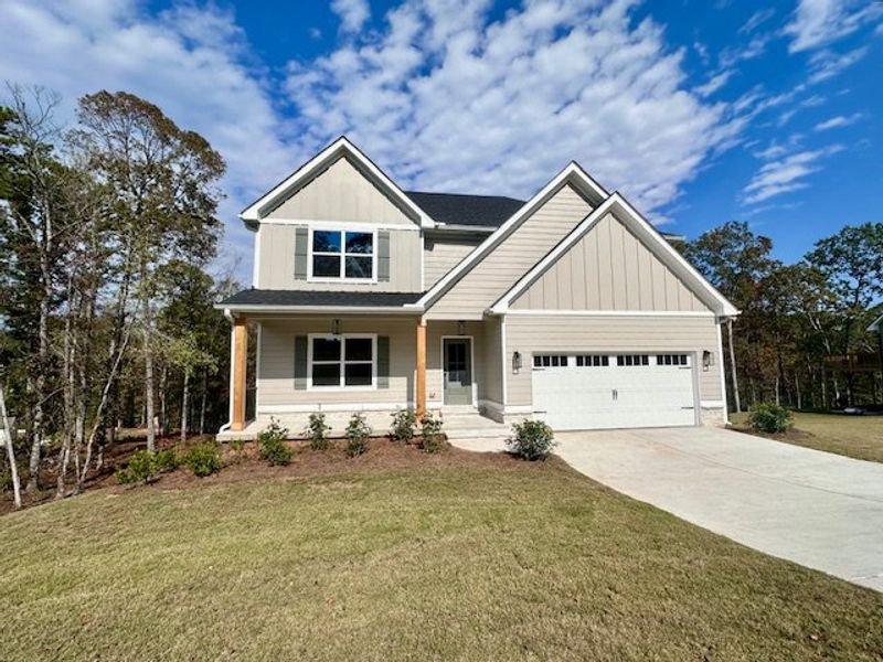 Front exterior of a new home in Sagebrook, Newnan, GA, highlighting curb appeal (Image 1).