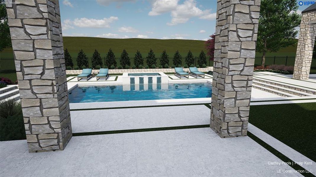 Stone-clad columns frame an outdoor entertainment area featuring a rectangular pool with an integrated spa Stone-clad columns frame an outdoor entertainment area featuring a rectangular pool with an integrated spa