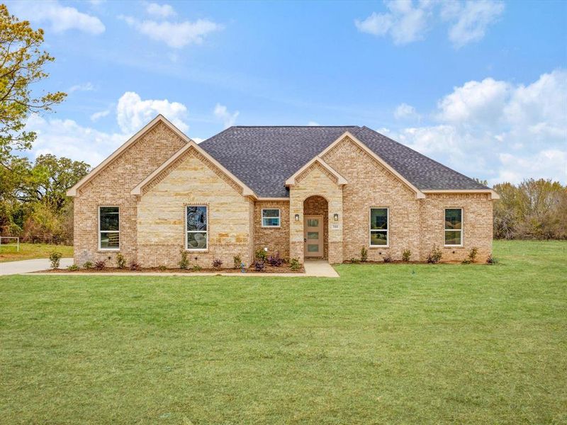 View of front of house with roof with shingles, a front lawn, and brick siding View of front of house with roof with shingles, a front lawn, and brick siding
