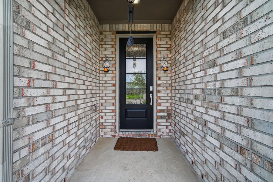 Exterior details and patio area of a home in Sunterra, Katy (Image 3). Exterior details and patio area of a home in Sunterra, Katy (Image 3).