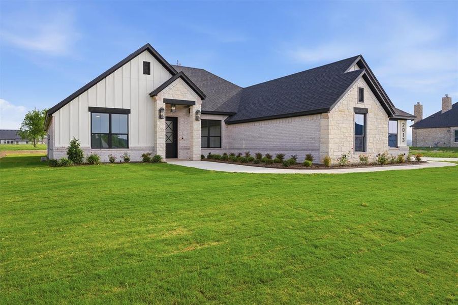 Front exterior of a new home in , Weatherford, TX, highlighting curb appeal (Image 2). Front exterior of a new home in , Weatherford, TX, highlighting curb appeal (Image 2).