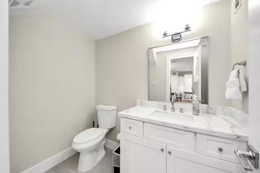 A conveniently located first-floor powder bath gives guests their own space without bringing traffic into the upstairs bedroom areas.