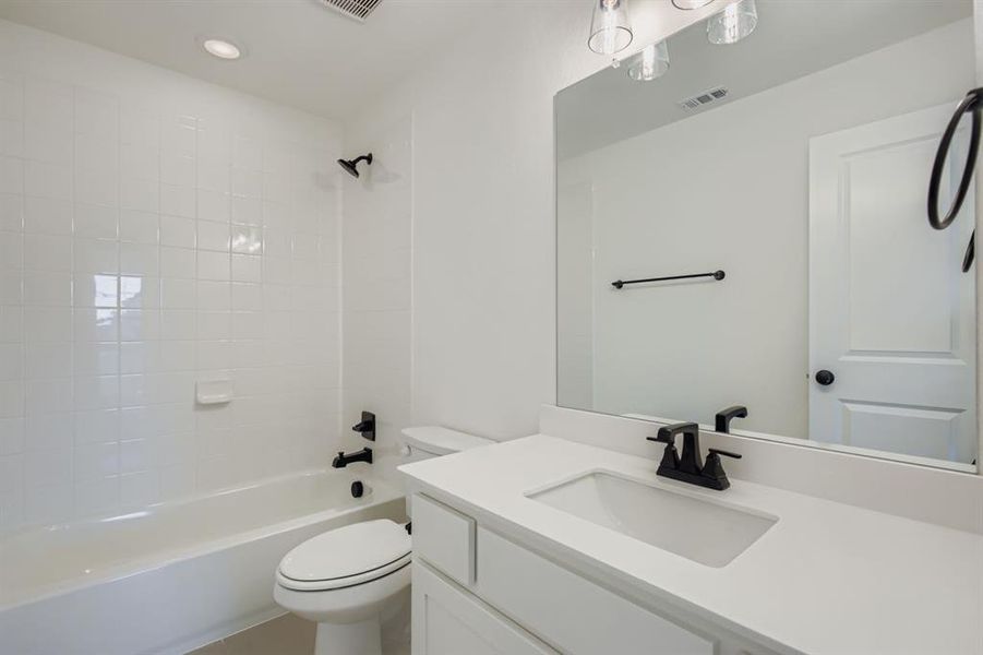 Full bath with vanity, shower combination, and recessed lighting Full bath with vanity, shower combination, and recessed lighting