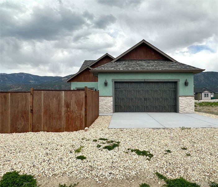 Front exterior of a new home in , Poncha Springs, CO, highlighting curb appeal (Image 21).