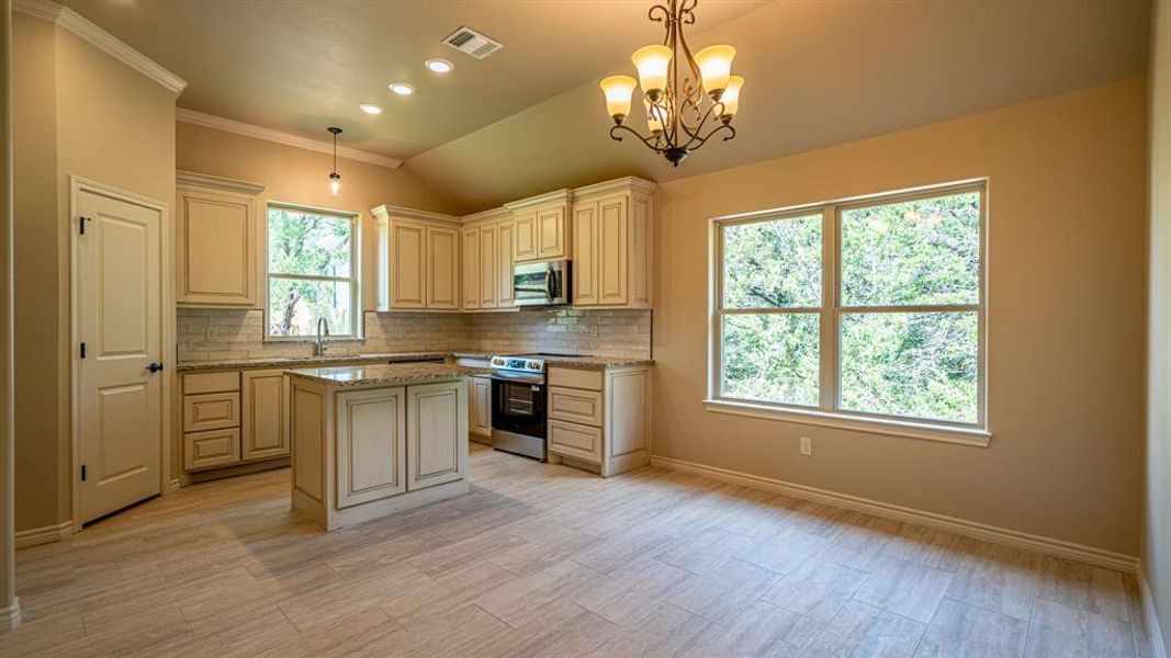 Kitchen with beautiful custom cabinets and center island Kitchen with beautiful custom cabinets and center island