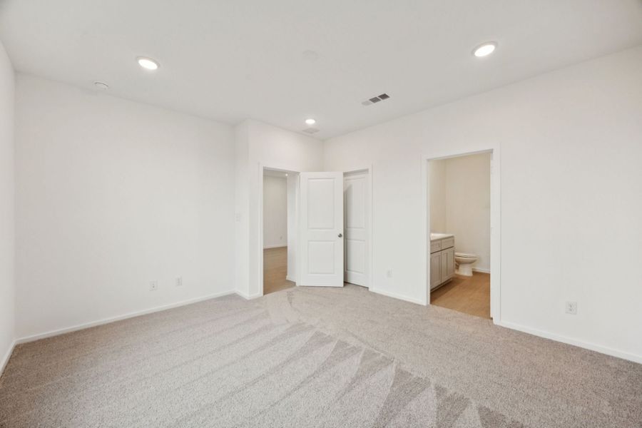 Representative unfurnished interior of a home built from the Beeville by Pulte Homes in Saddleback at Santa Rita Ranch, Liberty Hill (Image 18).