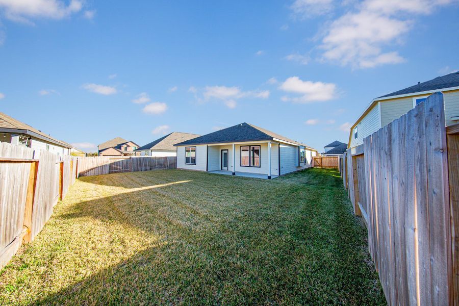 Exterior details and patio area of a home in Bluestem, Brookshire (Image 3). Exterior details and patio area of a home in Bluestem, Brookshire (Image 3).