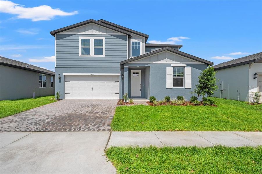Front exterior of a new home in Two Rivers - Classic Series, Zephyrhills, FL, highlighting curb appeal (Image 28).