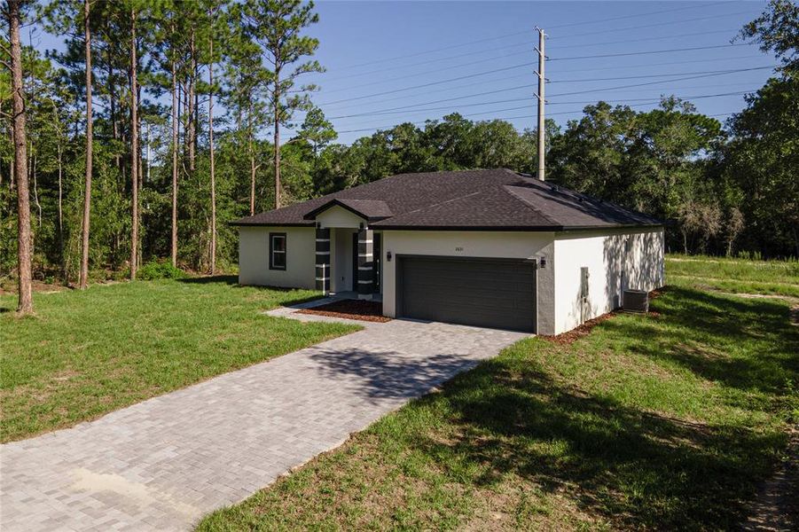 Front exterior of a new home in , Citrus Springs, FL, highlighting curb appeal (Image 22).