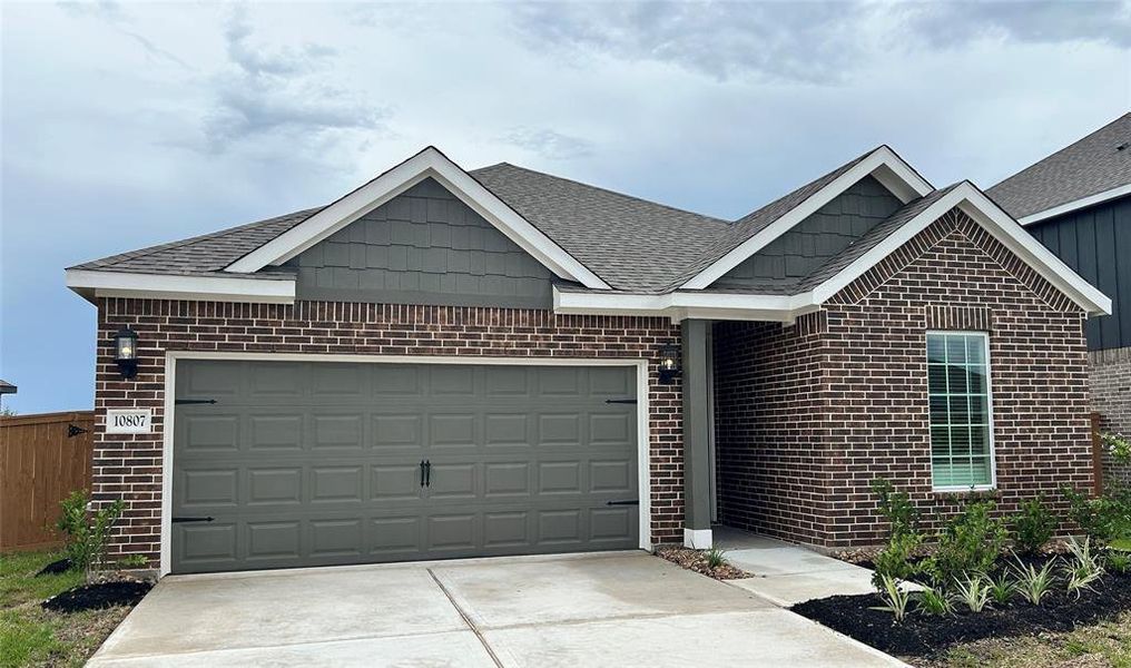 The Montgomery plan features 3 bedrooms, 2 bathrooms, and a 2 car garage.