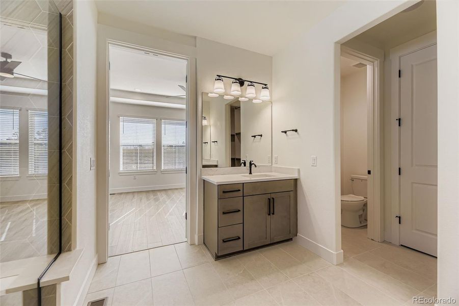 Furnished interior view inside a new home in Hilltop 55+ at Inspiration 62s, Aurora (Image 9).