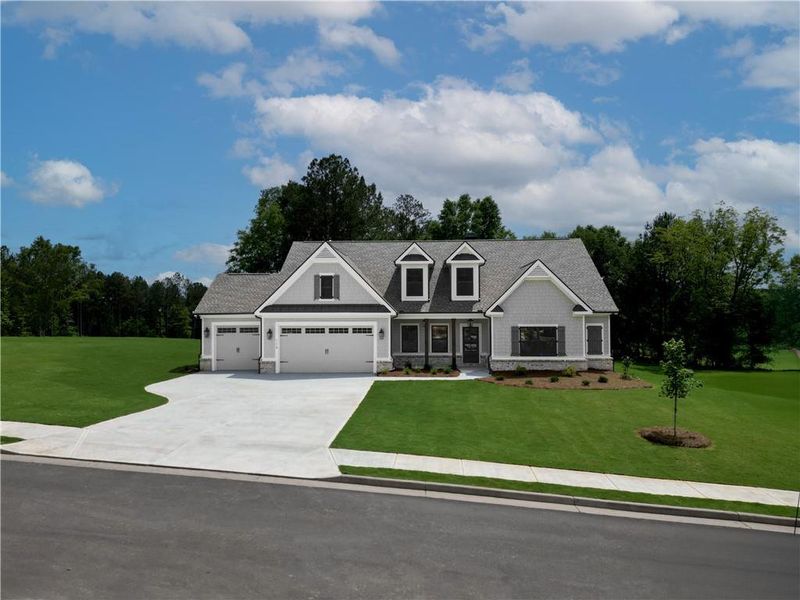 Front exterior of a new home in Riverwalk, Monroe, GA, highlighting curb appeal (Image 1). Front exterior of a new home in Riverwalk, Monroe, GA, highlighting curb appeal (Image 1).