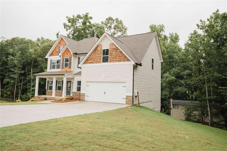 Front exterior of a new home in , Douglasville, GA, highlighting curb appeal (Image 27). Front exterior of a new home in , Douglasville, GA, highlighting curb appeal (Image 27).