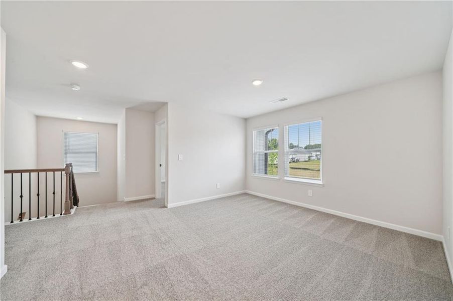 Spacious, unfurnished interior of a new home in Vines at Mill Creek - Estate Series, Braselton (Image 28).