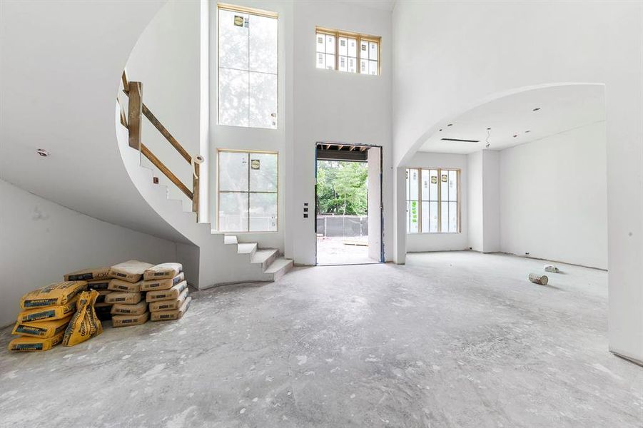 A grand piano would look elegant in this open nook under the staircase.