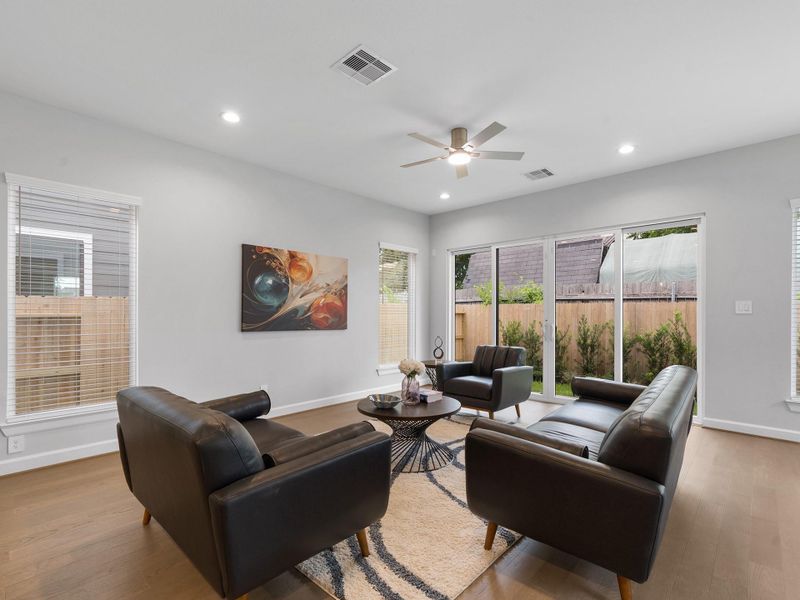 The ROCcreek features a bright, open living room designed for effortless entertaining and stylish everyday comfort. Image depicts home as-is.