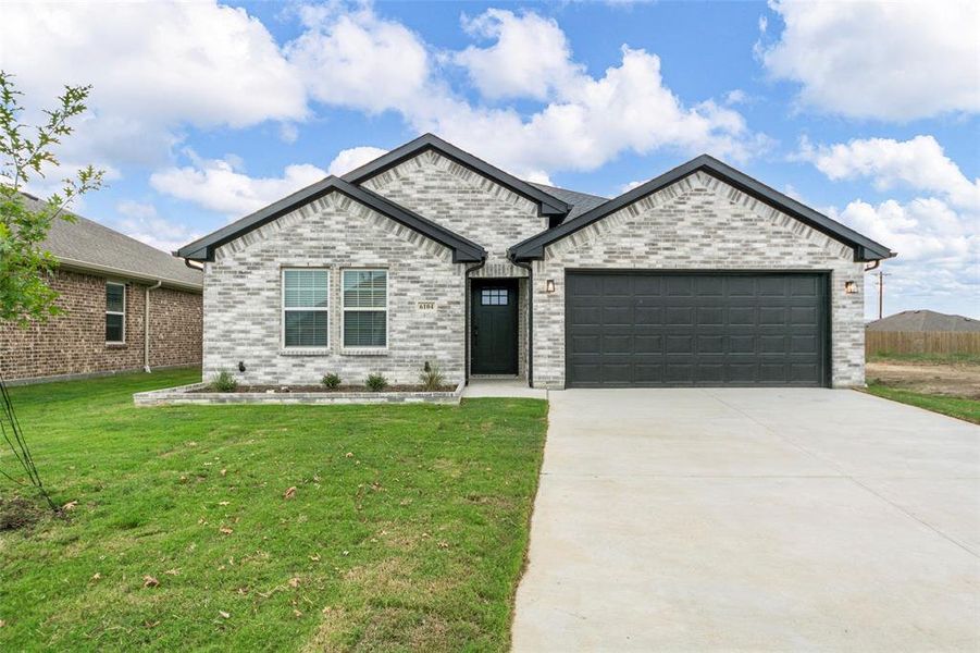 Front exterior of a new home in , Greenville, TX, highlighting curb appeal (Image 2). Front exterior of a new home in , Greenville, TX, highlighting curb appeal (Image 2).