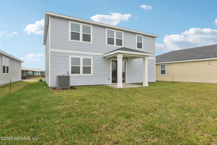 Front exterior of a new home in Lakes at Bella Lago - Signature Series, Green Cove Springs, FL, highlighting curb appeal (Image 19). Front exterior of a new home in Lakes at Bella Lago - Signature Series, Green Cove Springs, FL, highlighting curb appeal (Image 19).
