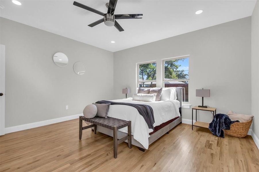 Bedroom with recessed lighting, light wood-style floors, and ceiling fan
