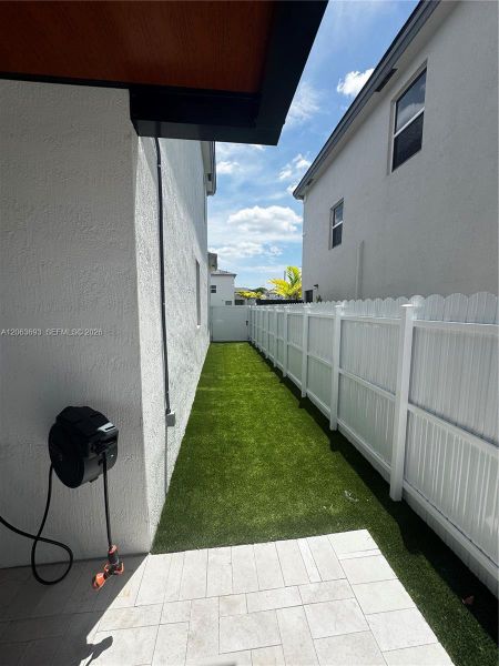 Exterior details and patio area of a home in Beacon at Galiano Pointe, Miami (Image 18). Exterior details and patio area of a home in Beacon at Galiano Pointe, Miami (Image 18).