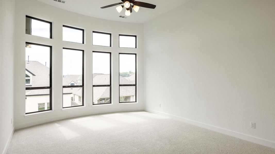Spare room with carpet floors and ceiling fan
