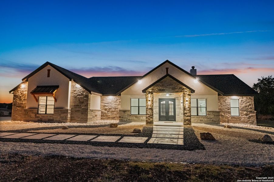 Front exterior of a new home in , Bandera, TX, highlighting curb appeal (Image 25).