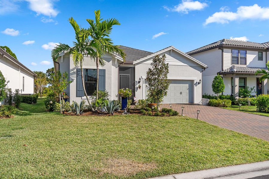 Front exterior of a new home in Veranda Gardens, Port St. Lucie, FL, highlighting curb appeal (Image 21). Front exterior of a new home in Veranda Gardens, Port St. Lucie, FL, highlighting curb appeal (Image 21).