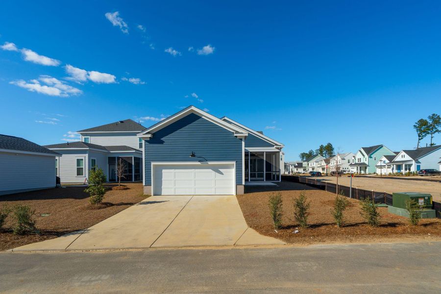 Front exterior of a new home in Nexton, Summerville, SC, highlighting curb appeal (Image 18).