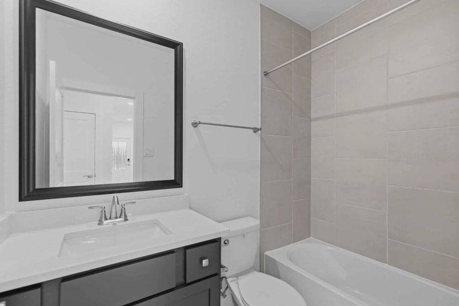 Representative furnished interior of a home built from the Springfield by Chesmar Homes in Bridgeland, Elgin (Image 5).