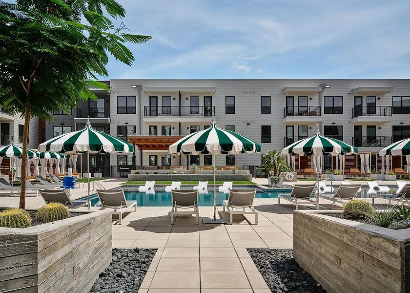 Community pool featuring a patio