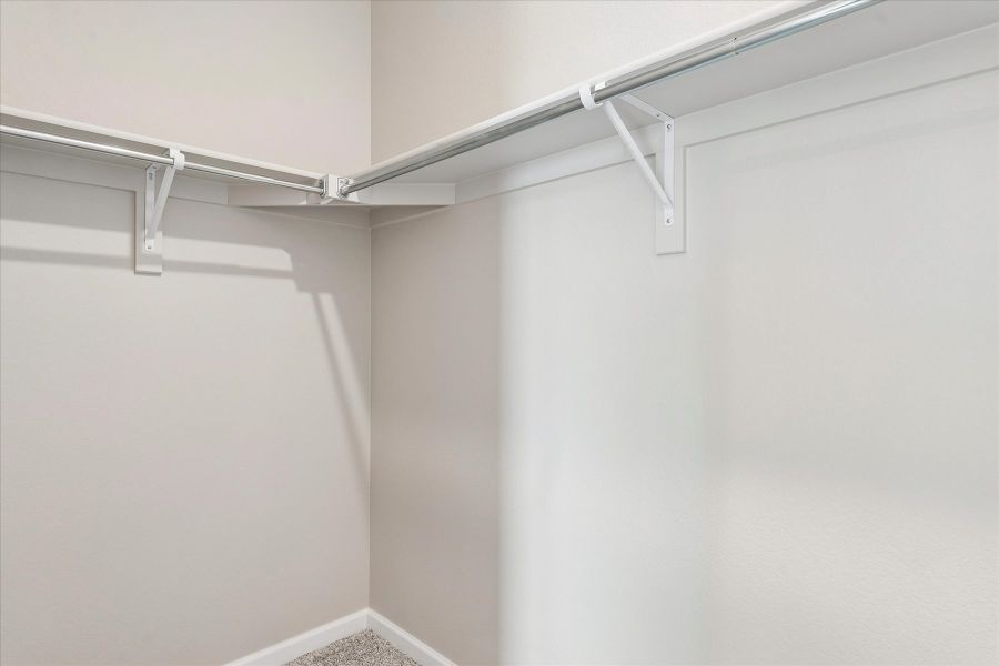 A white ceiling with a metal railing.