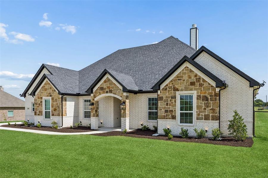 Front exterior of a new home in , Reno, TX, highlighting curb appeal (Image 21). Front exterior of a new home in , Reno, TX, highlighting curb appeal (Image 21).