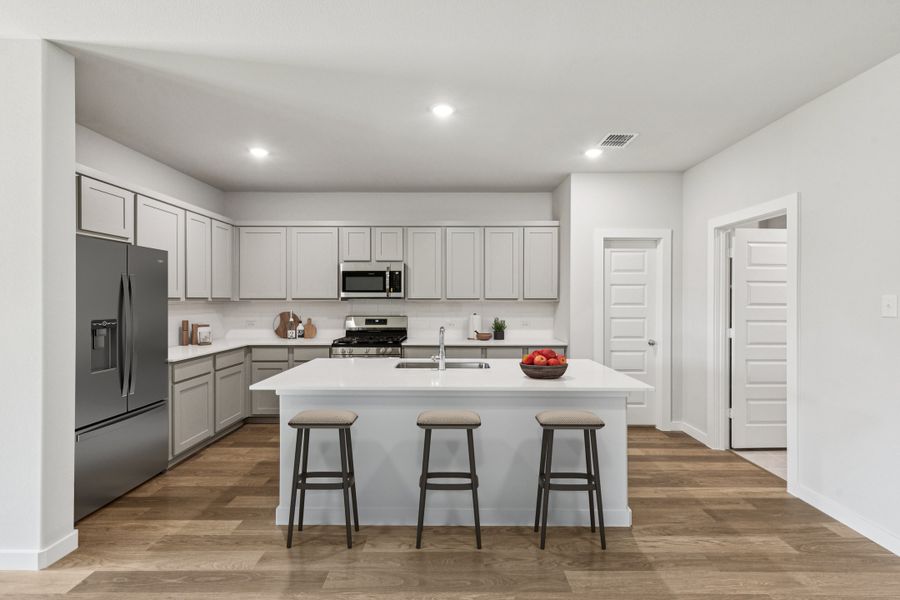 Kitchen in the Oscar home plan by Trophy Signature Homes – REPRESENTATIVE PHOTO Kitchen in the Oscar home plan by Trophy Signature Homes – REPRESENTATIVE PHOTO