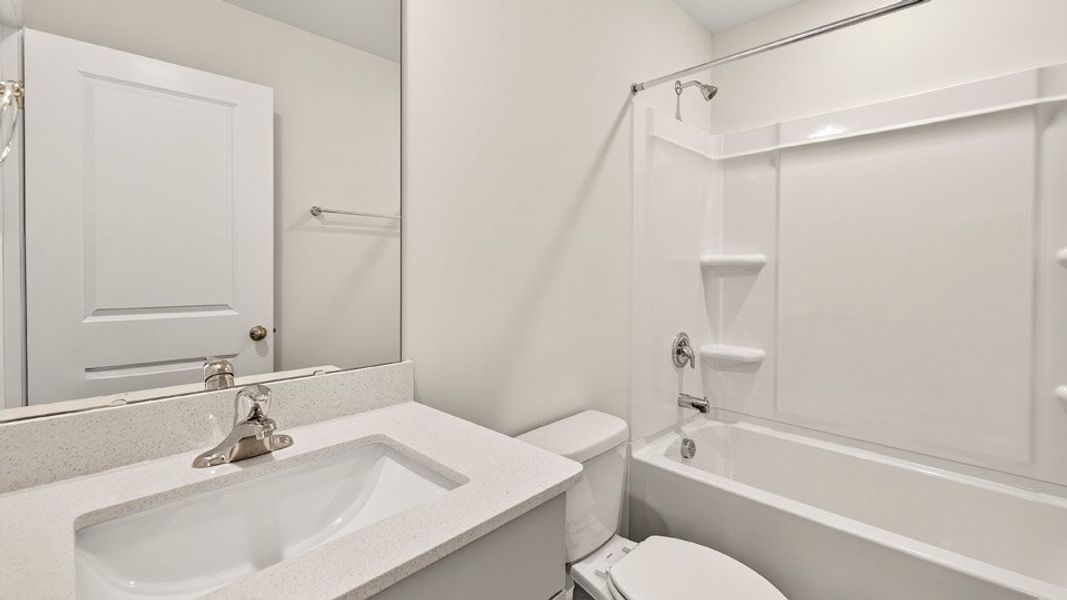 Representative furnished interior of a home built from the OLIVER by D.R. Horton in Barwell Park, Raleigh (Image 16).