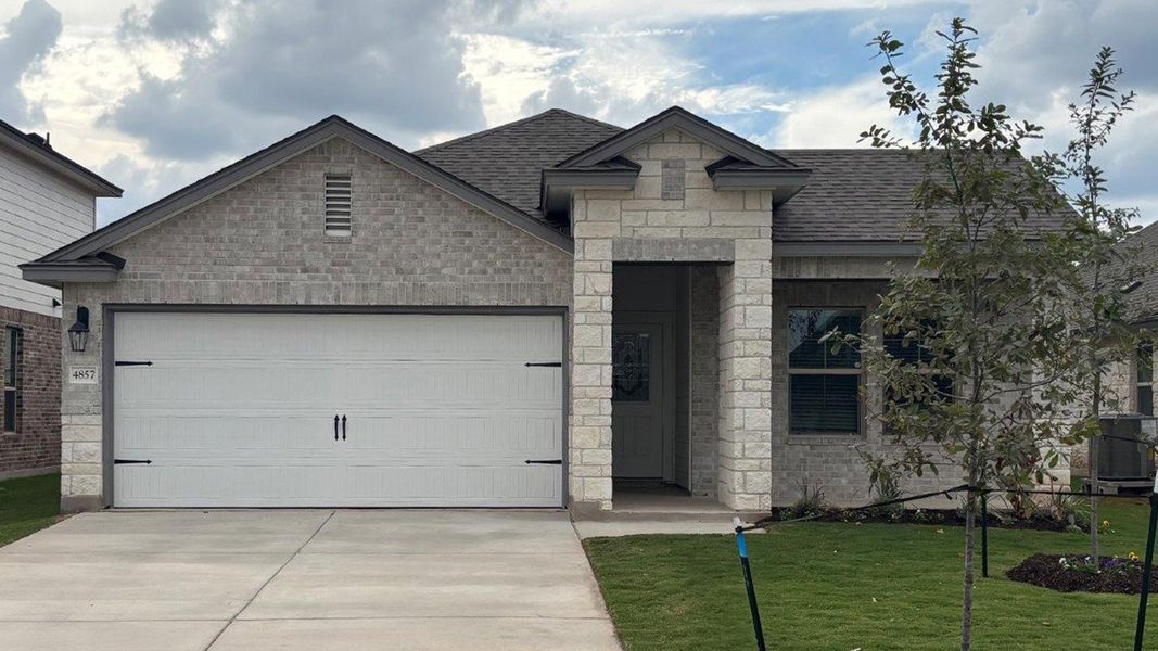 Front exterior of a new home in Three Creeks - Colt Creek, Belton, TX, highlighting curb appeal (Image 1). Front exterior of a new home in Three Creeks - Colt Creek, Belton, TX, highlighting curb appeal (Image 1).