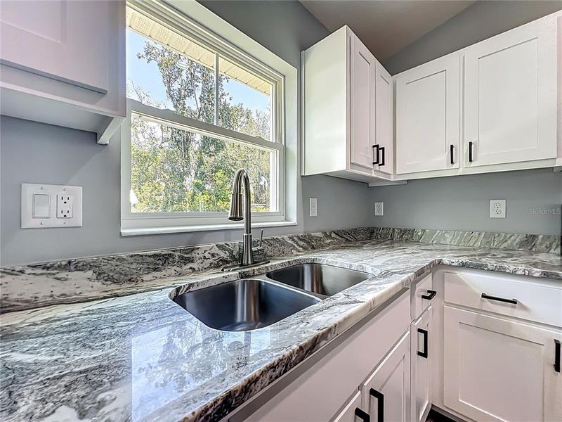 Furnished interior view inside a new home in , Lake Panasoffkee (Image 11).