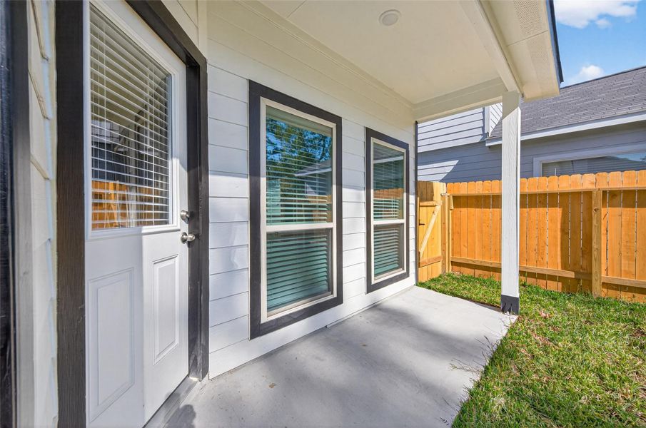 Exterior details and patio area of a home in Woodland Lakes, Huffman (Image 23).