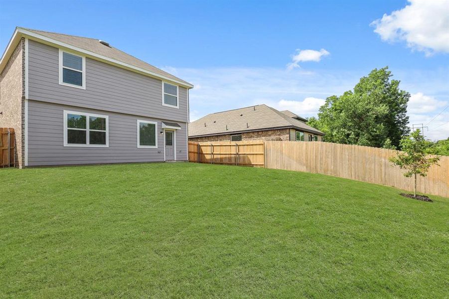Front exterior of a new home in Christian Meadows, Ennis, TX, highlighting curb appeal (Image 2). Front exterior of a new home in Christian Meadows, Ennis, TX, highlighting curb appeal (Image 2).
