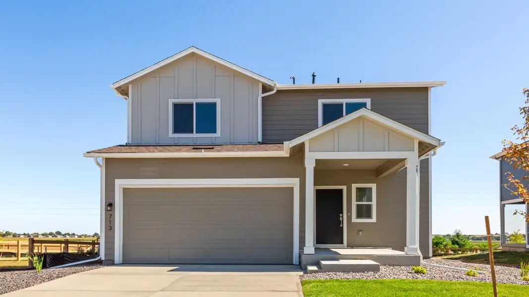 Front exterior of a new home in Granary, Johnstown, CO, highlighting curb appeal (Image 2). Front exterior of a new home in Granary, Johnstown, CO, highlighting curb appeal (Image 2).