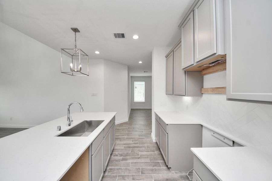 The extended counter area adds both practicality and style, making meal preparation a breeze. Every detail is thoughtfully designed to enhance the kitchen's functionality and aesthetic appeal. The extended counter area adds both practicality and style, making meal preparation a breeze. Every detail is thoughtfully designed to enhance the kitchen's functionality and aesthetic appeal.