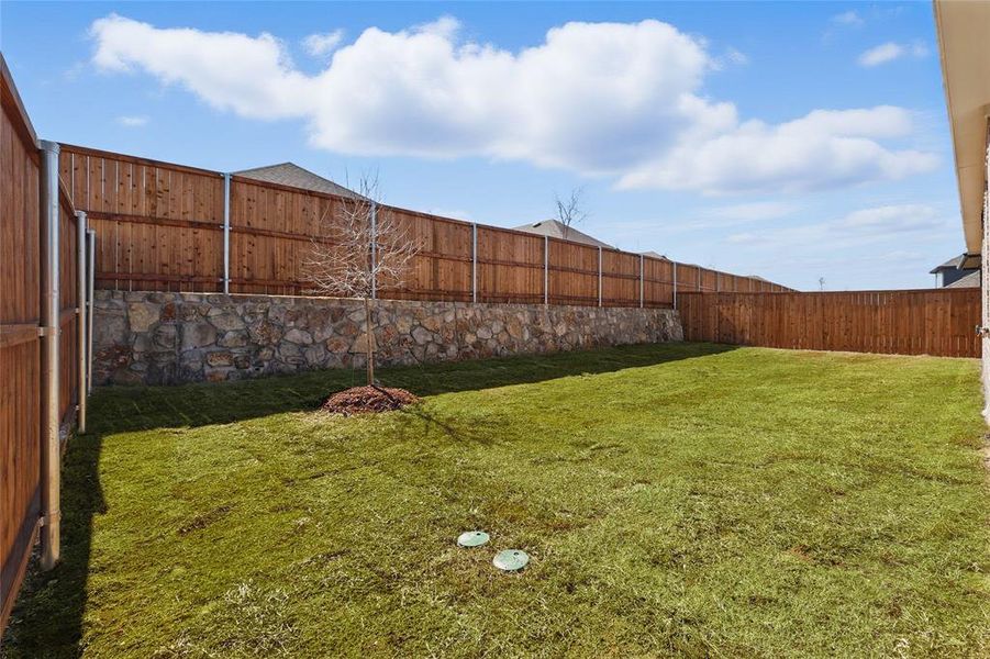 View of yard with a fenced backyard