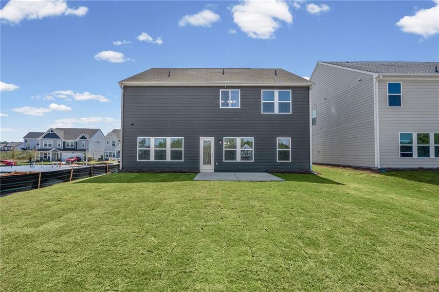 Exterior details and patio area of a home in Twin Lakes, Hoschton (Image 28).