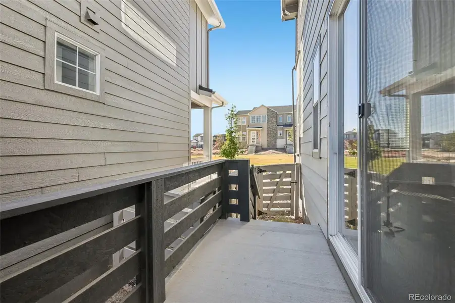 Exterior details and patio area of a home in The Villas Collection at Sterling Ranch, Littleton (Image 2).