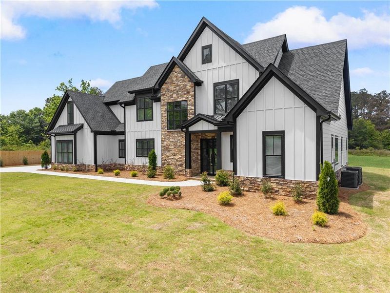 Front exterior of a new home in , Cumming, GA, highlighting curb appeal (Image 28). Front exterior of a new home in , Cumming, GA, highlighting curb appeal (Image 28).